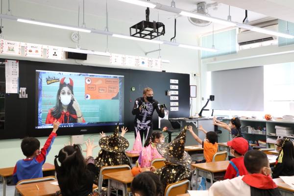 Mr. Graham is teaching students Halloween words.