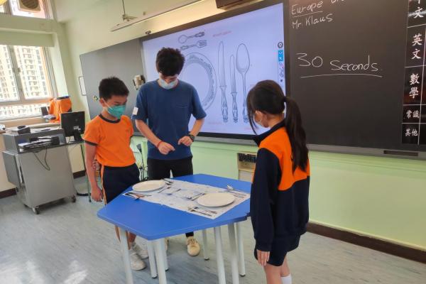 Students are learning the table manner in Europe.