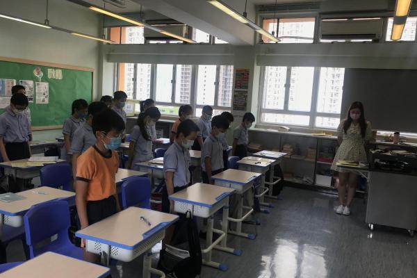 Teachers led students in observing a moment of silence for those who died in the war.