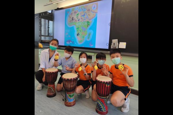 Students are playing African drums.