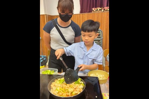 There were many little master chefs in the competition. This student stirred and flipped with impressive skill!